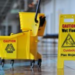 Mop bucket and caution sign